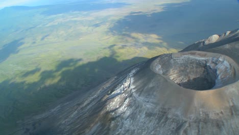 an aerial shot over the oldoinyo le ngai volcano in tanzania