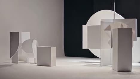 abstract geometric shapes in a white studio