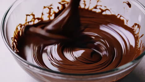 melting and mixing chocolate in a glass bowl
