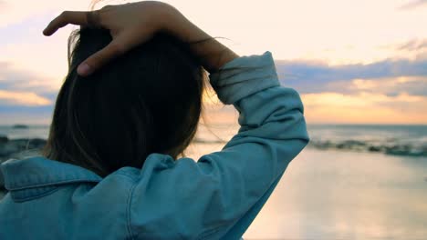 woman standing at beach 4k