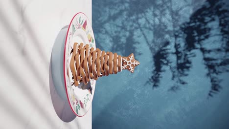 chocolate-cake-with-cookies-on-pyramid-in-white-cloth-table-with-animated-blue-background