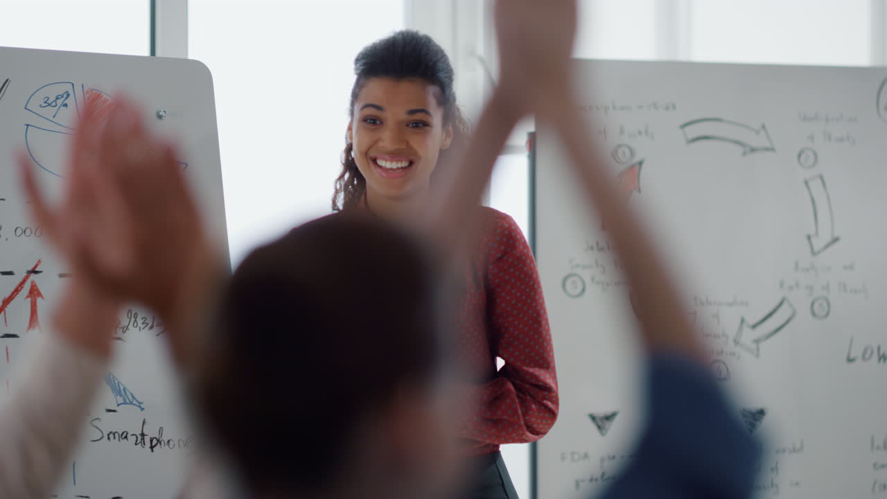 Smart colleague celebrating success office. Business people applauding speaker