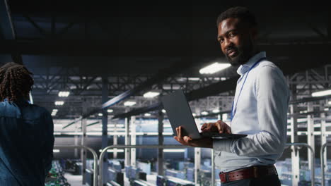 happy technician and colleague in data center reviewing ai llm visualizations