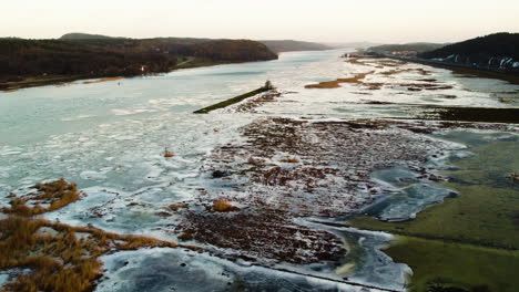 Frozen-Flooded-Bank-Of-Gota-Alv-River-During-Winter-In-Sweden,-Aerial