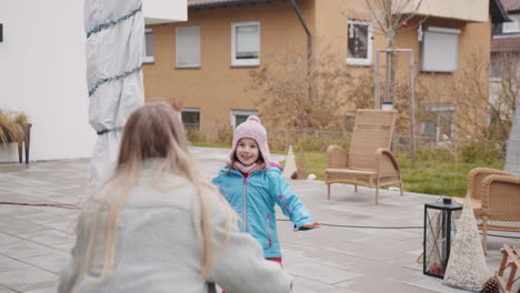 mother and daughter hugging outdoors in winter