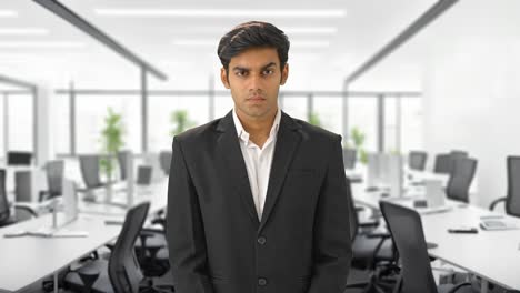 indian businessman staring at the employees
