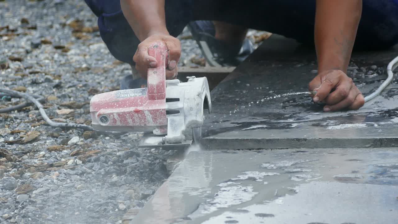 Man cutting granite stone