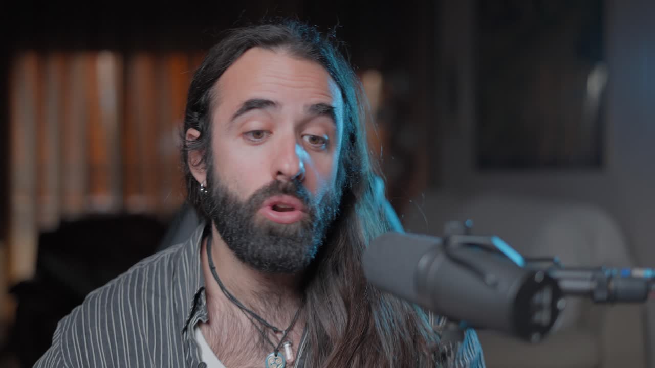 Man Giving a Podcast Interview in a Home Studio
