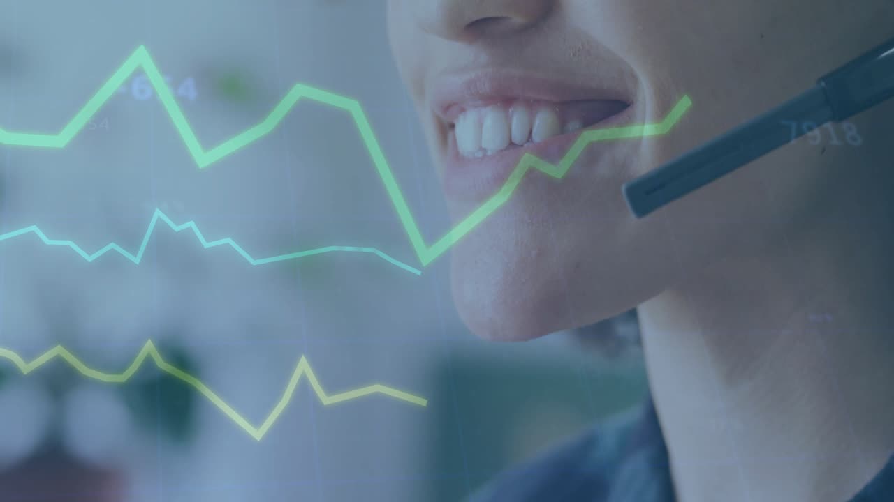 Call center agent responding to caller with smile adjusting headset and showing data graphs