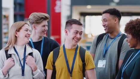 portrait of college student friends meeting in busy communal campus building