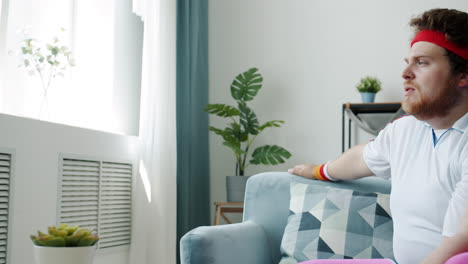 man working out on couch