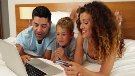 parents shopping online with their son