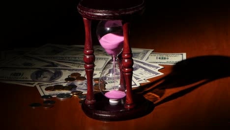 hourglass with money