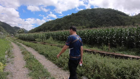 a villager walking and drinking water