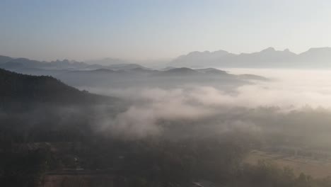 morning fog and clouds over forest tops in chiang dao