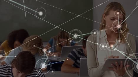 Network-of-connections-against-portrait-of-caucasian-female-teacher-using-digital-tablet-in-class