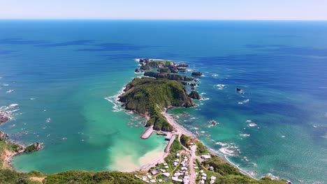 aerial view at estaquilla with turquoise pacific ocean waters spanning across out to horizon