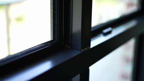 a close-up view of a modern window frame showcasing sleek design and natural light entering the space, highlighting architectural details and aesthetic appeal