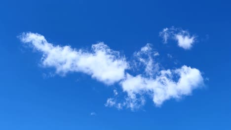fluffy clouds scattered across a clear blue sky in tokyo