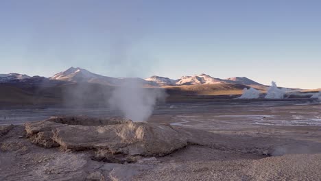 el tatio geyser steaming in the atacama desert in chile, south america