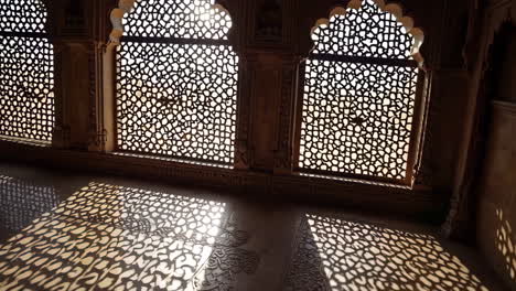 intricate jali windows and shadows in a palace interior