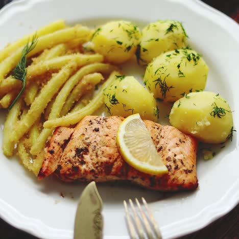 Fresh-and-tasty-baked-salmon-served-with-young-boiled-potatoes-and-yellow-bean