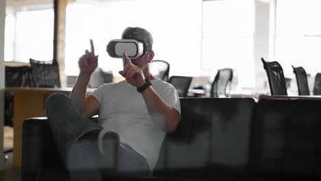 executive using virtual reality headset on sofa 4k
