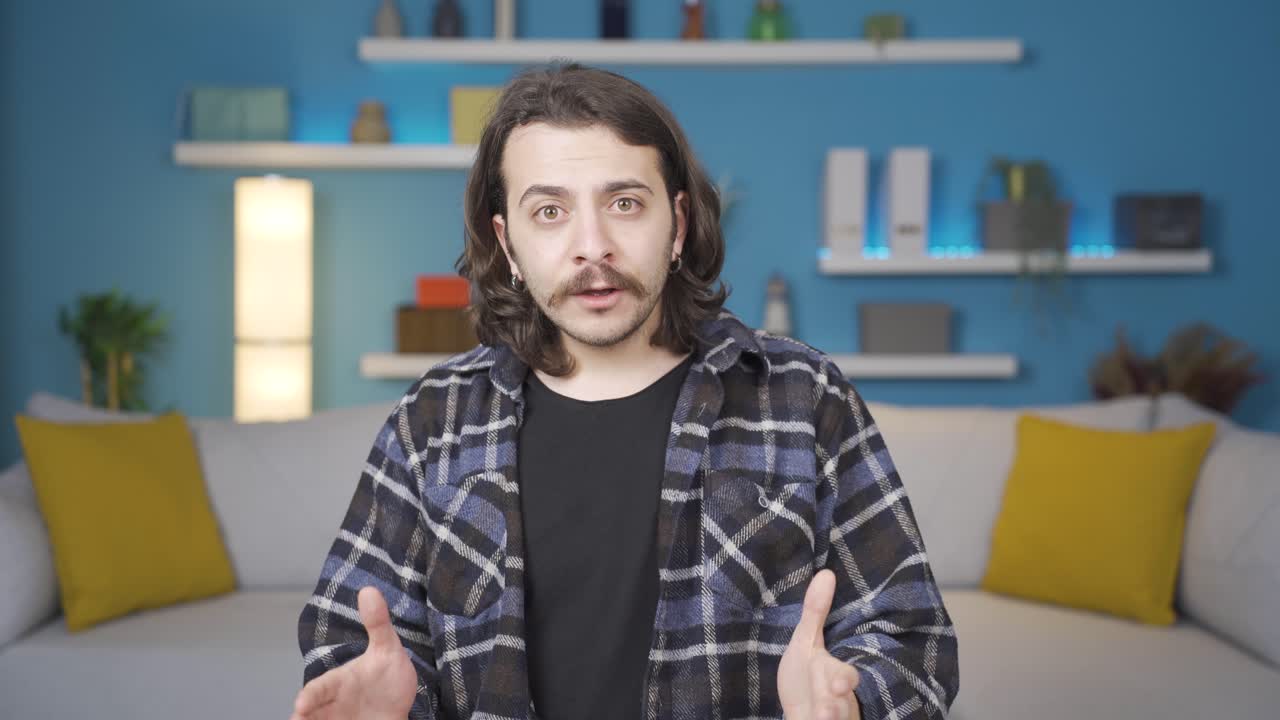 Man applauding success. He is looking at the camera.