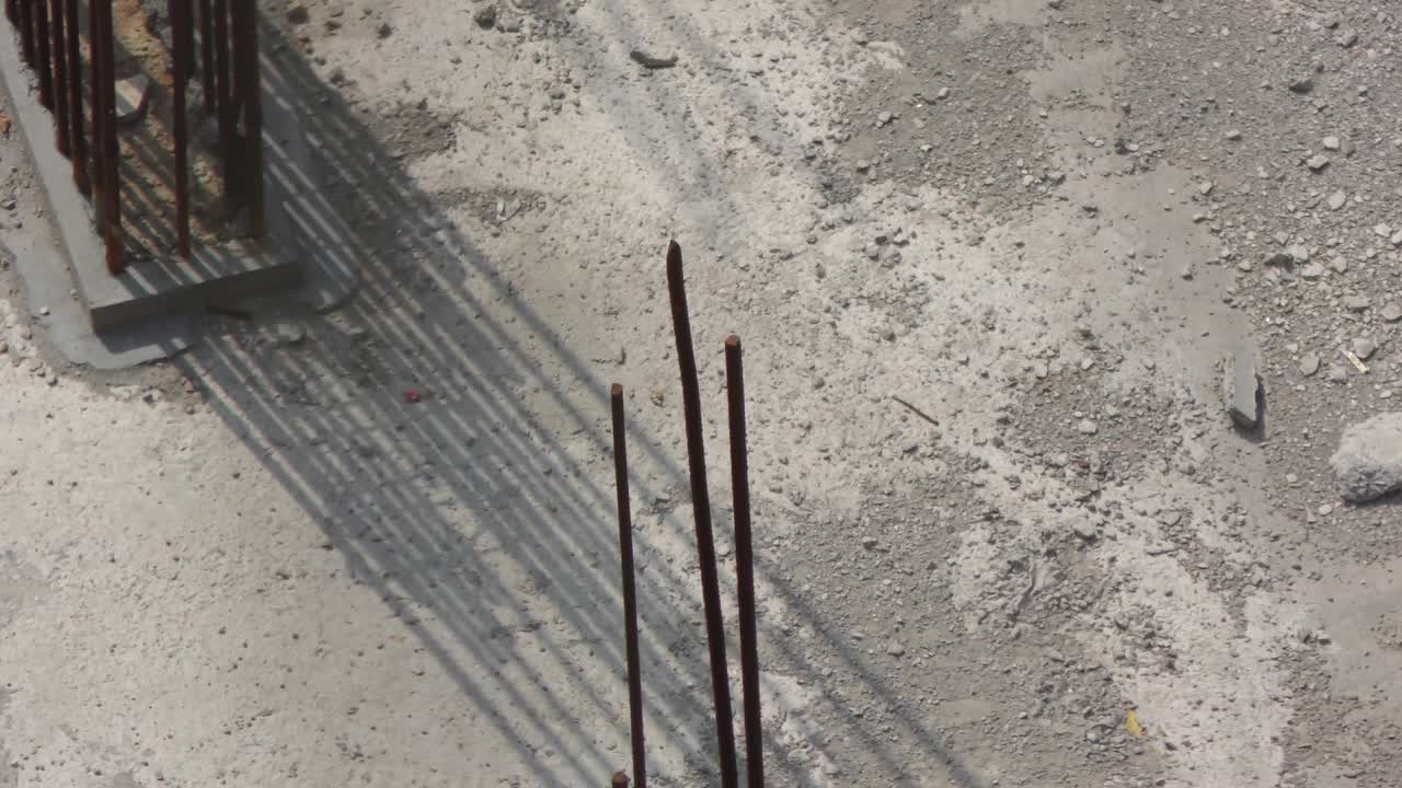 Construction site with raw iron bars and lots of other items