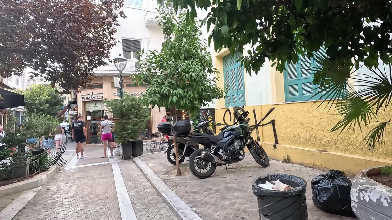 Walking to a busy touristic place in Athens.