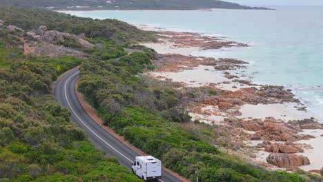 motorhome van driving along coastal road in dunsborough, western australia