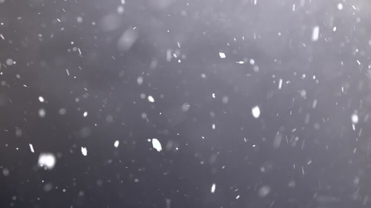 Swirling Snowfall Against Black Background
