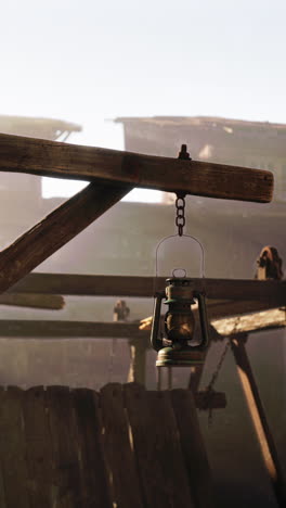 vintage lantern hanging from a wooden structure