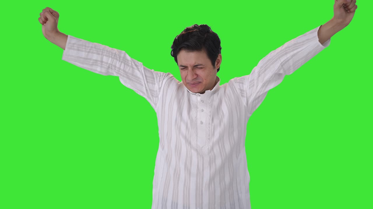 Tired and lazy Indian man yawning Green screen