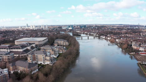 Dolly-forward-drone-shot-over-thames-river-towards-Kew-railway-bridge-London-West