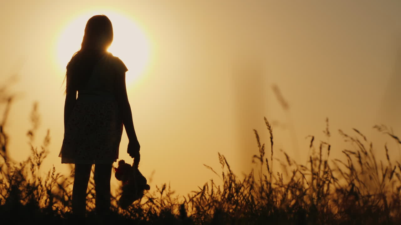Silhouette Of A Girl With Balloons And A Teddy Bear It Is Worth The Sunset Farewell To Childhood Con
