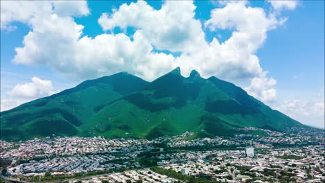 Amazing-aerial-drone-hyperlapse-of-El-Cerro-de-la-Silla-with-moving-clouds-in-Nuevo-Leon,-Mexico