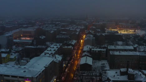 Shutting-down-the-city-lights-in-the-morning,-view-from-drone