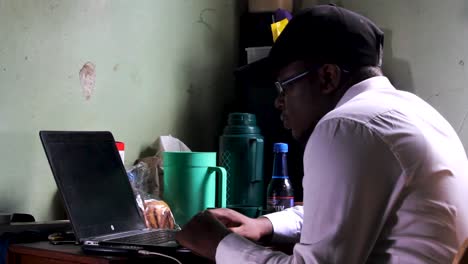 A-young-man-writing-on-laptop