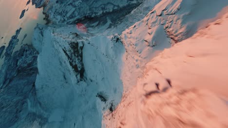 fpv drone flight in lofoten sunset over a mountain