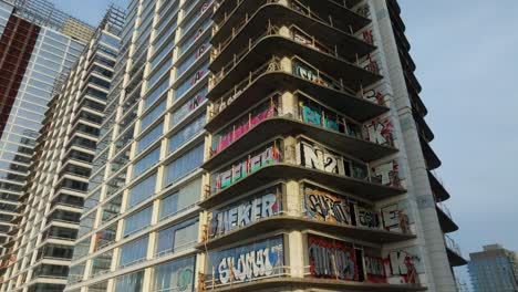 4k aerial of graffiti tower in dtla in february 2024, los angeles, california, usa