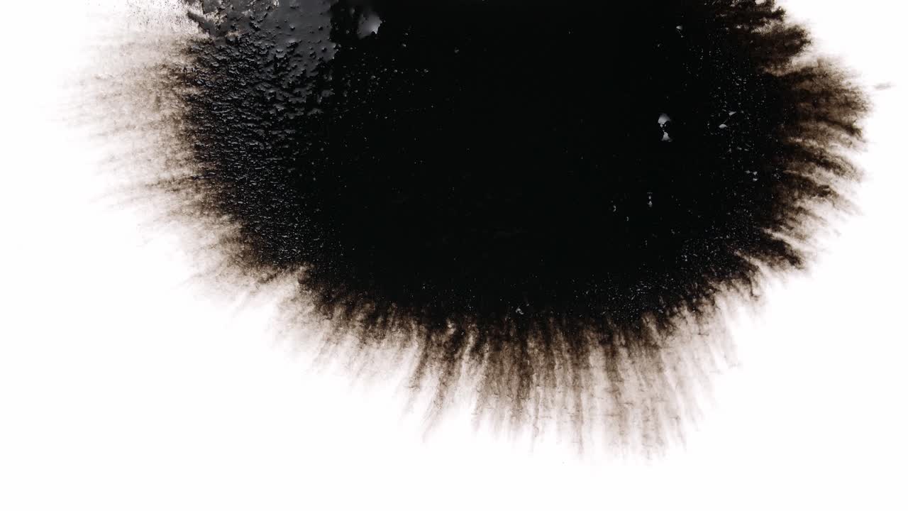 Black Ink Drops On White Background