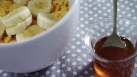bowl of corn flakes with banana 4k