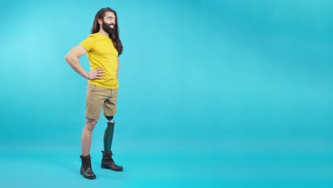 man with prosthetic leg standing confidently against a blue background