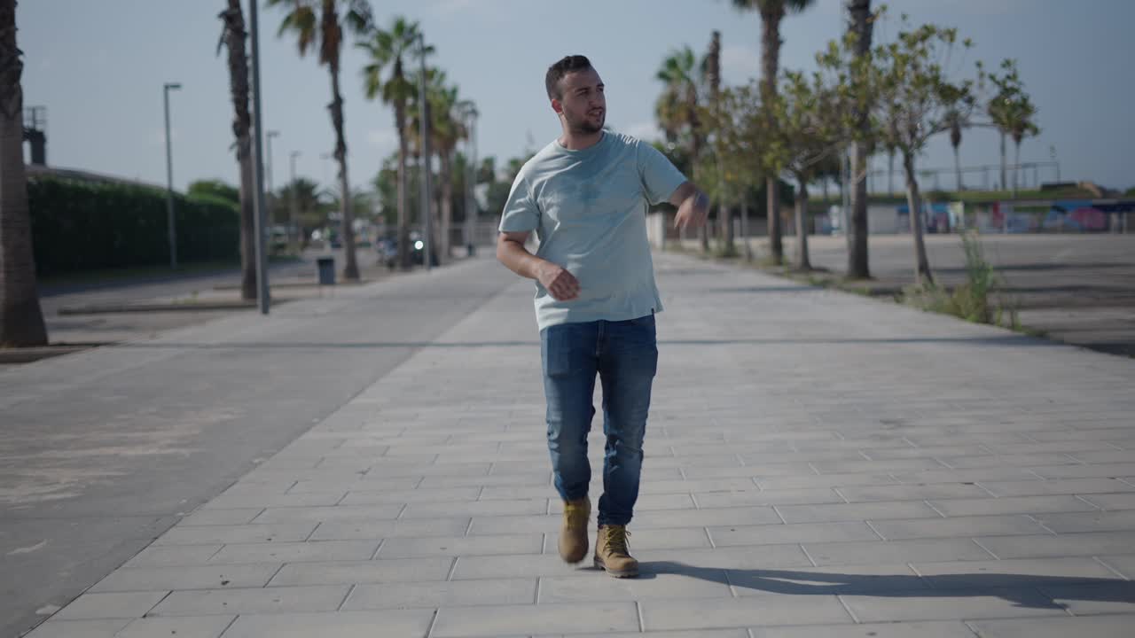 Man Walking Down a City Sidewalk