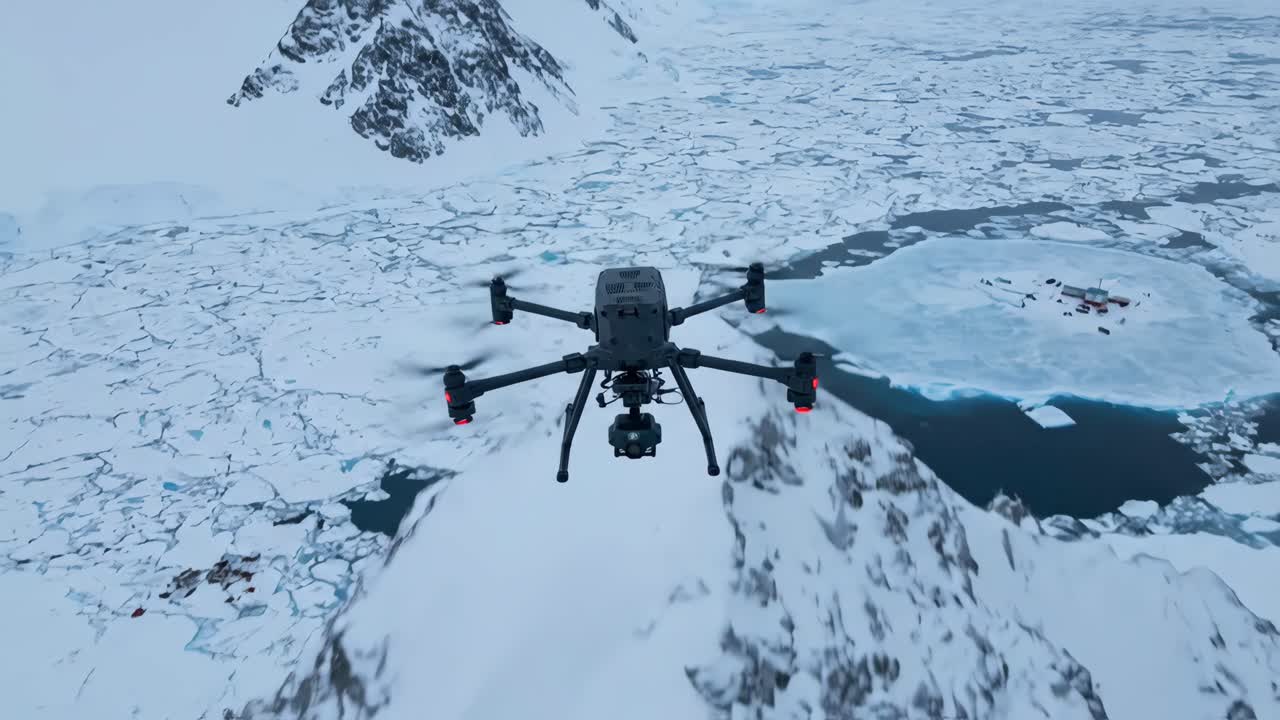 Drone Flying Over Icy Arctic Ocean and Snow-Covered Mountains