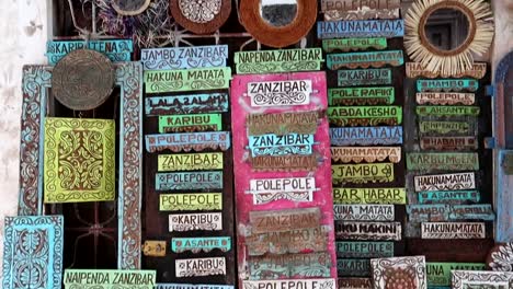 Handmade-wooden-panels-with-some-Zanzibar-typical-words-as-a-way-of-life-and-philosophy