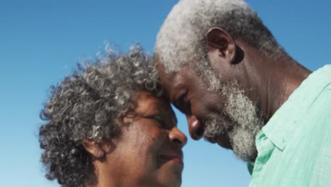 senior couple dancing at the beach