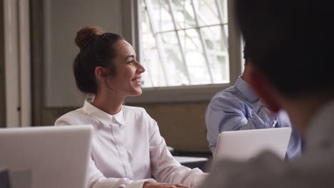 Close-up-of-business-colleagues-at-a-board-meeting