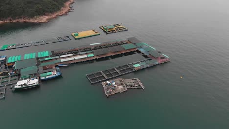high altitude drone dolly shot of a fish farm